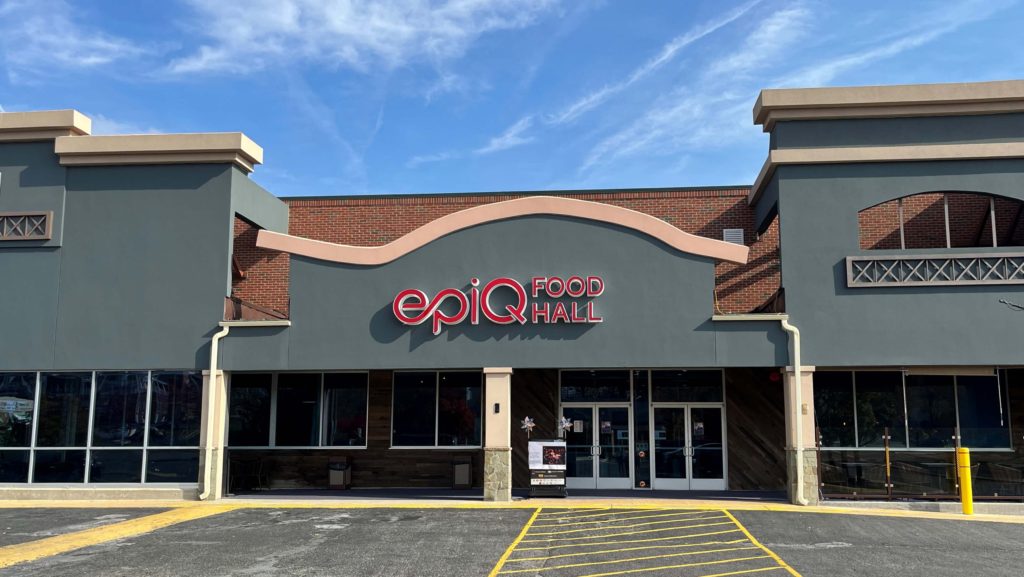 the exterior of Epiq Food Hall, a large two-story building